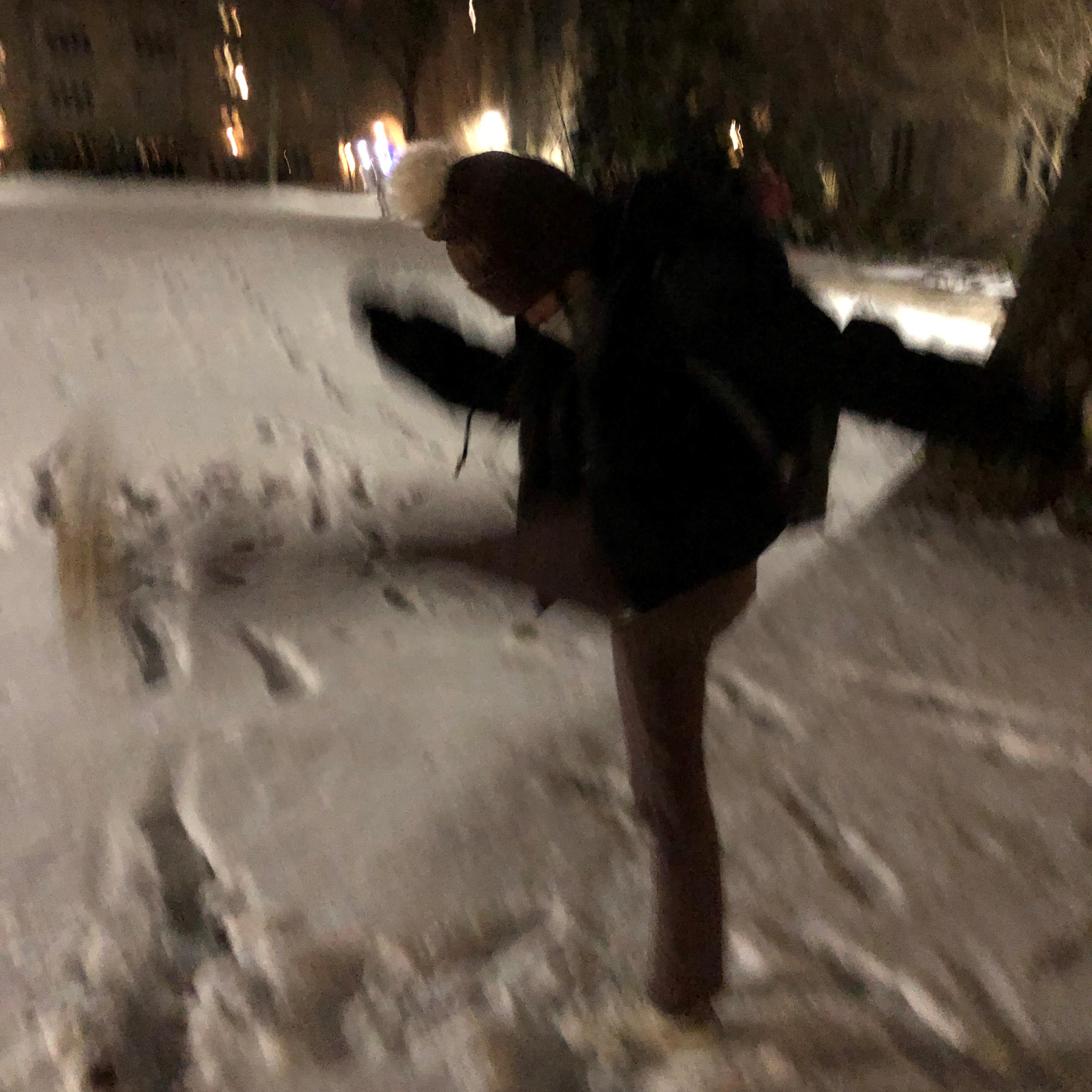 kelly kicking at the snow in a blur